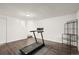 Spacious finished basement with wood-look flooring and workout equipment at 670 Winona Ct # 38, Denver, CO 80204