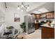 Dining area with modern lighting, table, and stainless steel appliances in kitchen at 670 Winona Ct # 38, Denver, CO 80204