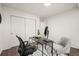 Home office with a desk, computer, sliding closet doors, and natural light at 670 Winona Ct # 38, Denver, CO 80204
