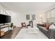 Relaxing living room featuring a comfortable sofa, stylish decor, and lots of light at 670 Winona Ct # 38, Denver, CO 80204