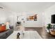 Cozy living room view to dining area and open kitchen, lots of natural light at 670 Winona Ct # 38, Denver, CO 80204