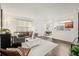 Comfortable living room featuring a gray sofa, stylish decor, and lots of natural light at 670 Winona Ct # 38, Denver, CO 80204
