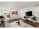 Open living room and dining area leading to stairs and an open-concept kitchen at 670 Winona Ct # 38, Denver, CO 80204