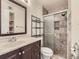 Bathroom with glass enclosed shower, tile, updated vanity at 4400 S Quebec St # M-204, Denver, CO 80237