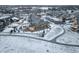Charming home featuring a fenced backyard, set within a picturesque, snow-dusted neighborhood at 1060 Arrowhead Ct, Erie, CO 80516