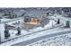 Back exterior showcasing a covered patio and fenced yard, ideal for outdoor enjoyment and privacy at 1060 Arrowhead Ct, Erie, CO 80516