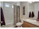 Neutral bathroom featuring a shower-tub combo with a decorative floral shower curtain at 1060 Arrowhead Ct, Erie, CO 80516