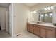 Bathroom featuring double sinks and a large mirror at 1060 Arrowhead Ct, Erie, CO 80516