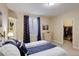 Comfortable bedroom featuring a closet with storage space and a large window at 1060 Arrowhead Ct, Erie, CO 80516