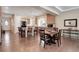 Open kitchen boasts stainless steel appliances, granite countertops, an island with seating, and hardwood floors at 1060 Arrowhead Ct, Erie, CO 80516