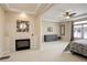 Spacious main bedroom boasting a cozy fireplace and ample natural light from the large window at 1060 Arrowhead Ct, Erie, CO 80516