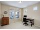 Bright office space featuring a wooden desk and a large window offering natural light at 1060 Arrowhead Ct, Erie, CO 80516