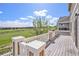 Inviting back deck with white railings overlooks a beautiful green space with a golf course, perfect for entertaining at 11748 Mill Valley St, Parker, CO 80138