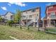 A two-story home with a backyard featuring a deck, stairs, and a wooden fence, perfect for outdoor enjoyment at 11748 Mill Valley St, Parker, CO 80138