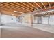 Unfinished basement featuring exposed beams and spacious layout at 11748 Mill Valley St, Parker, CO 80138