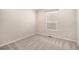 Neat bedroom with neutral tones, plush carpeting, and natural light at 11748 Mill Valley St, Parker, CO 80138