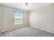 Clean bedroom featuring carpeted floors and a bright window at 11748 Mill Valley St, Parker, CO 80138
