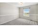 Neutral bedroom featuring carpeted floors and a view through the window at 11748 Mill Valley St, Parker, CO 80138