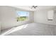 Bright bedroom with large windows offering outdoor views and plush neutral carpet at 11748 Mill Valley St, Parker, CO 80138