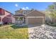 Charming two-story home with a spacious front yard and a two-car garage with stone details at 11748 Mill Valley St, Parker, CO 80138