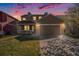 Charming two-story home with a spacious front yard and a two-car garage with stone details at 11748 Mill Valley St, Parker, CO 80138