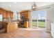 Bright eat-in kitchen features stainless appliances, granite countertops, hardwood floors and sliding doors to a deck at 11748 Mill Valley St, Parker, CO 80138