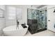Modern bathroom with a freestanding tub and glass-enclosed shower at 6762 Eagle Pl, Highlands Ranch, CO 80130