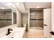 Full bathroom featuring a shower/tub combo, tiled walls, and a modern vanity at 6762 Eagle Pl, Highlands Ranch, CO 80130