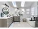 Luxurious bathroom featuring dual sinks, skylights, and modern fixtures at 6762 Eagle Pl, Highlands Ranch, CO 80130