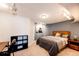 Modern bedroom featuring neutral tones, track lighting, and a cozy bed with stylish linens at 6762 Eagle Pl, Highlands Ranch, CO 80130
