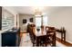 Cozy dining room featuring a large wooden table, a stylish chandelier, and ample space for Gathering gatherings at 6762 Eagle Pl, Highlands Ranch, CO 80130