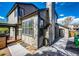 View of house corner featuring a chimney, adjacent pergola with a door leading to the backyard at 6762 Eagle Pl, Highlands Ranch, CO 80130