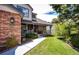 Lovely home with a brick facade, a covered porch, and manicured landscaping leading to the front entrance at 6762 Eagle Pl, Highlands Ranch, CO 80130