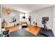 This home gym features exercise equipment and hardwood floors at 6762 Eagle Pl, Highlands Ranch, CO 80130