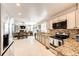 Spacious kitchen features stainless steel appliances, granite countertops, and open layout at 6762 Eagle Pl, Highlands Ranch, CO 80130