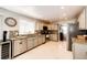 Well-lit kitchen features granite countertops, stainless steel appliances and tiled backsplash at 6762 Eagle Pl, Highlands Ranch, CO 80130