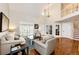 Welcoming living room with vaulted ceilings, hardwood floors, and an open layout ideal for relaxation and entertaining at 6762 Eagle Pl, Highlands Ranch, CO 80130