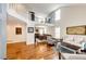 Spacious living room featuring hardwood floors, soaring ceilings, and an open layout perfect for entertaining guests at 6762 Eagle Pl, Highlands Ranch, CO 80130