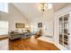 Bright and airy living room with vaulted ceilings, hardwood floors, and large windows offering plenty of natural light at 6762 Eagle Pl, Highlands Ranch, CO 80130