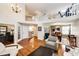 Elegant living room showcasing an open floor plan, hardwood floors, and a staircase leading to the upper level at 6762 Eagle Pl, Highlands Ranch, CO 80130