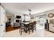 Cozy living space with access to the kitchen, dining, and outdoor seating areas at 6762 Eagle Pl, Highlands Ranch, CO 80130