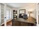 Stylish home office with a large desk, built-in shelves, and plenty of natural light for a productive workspace at 6762 Eagle Pl, Highlands Ranch, CO 80130