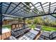 Inviting outdoor patio area with pergola, comfortable seating, and lush landscaping at 6762 Eagle Pl, Highlands Ranch, CO 80130