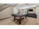 Finished basement features a pool table, a tv, and comfortable seating at 19884 E Villanova Pl, Aurora, CO 80013
