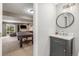 Stylish powder room featuring a round mirror and gray vanity at 19884 E Villanova Pl, Aurora, CO 80013