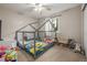 bedroom features unique house-frame bed, ceiling fan, and a window at 19884 E Villanova Pl, Aurora, CO 80013