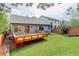 Backyard with a wood deck that connects to the house with a sliding glass door at 354 Willowick Cir, Highlands Ranch, CO 80129