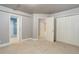 Spacious carpeted basement with closet and three open doorways to other rooms at 354 Willowick Cir, Highlands Ranch, CO 80129