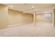 Spacious carpeted basement with a support beam, recessed lighting, and a window at 354 Willowick Cir, Highlands Ranch, CO 80129