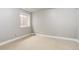 This carpeted room features a window and several electrical outlets along the base of the wall at 354 Willowick Cir, Highlands Ranch, CO 80129